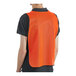 A man wearing an orange Lavex high visibility safety vest with a back view.