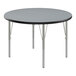 A round Correll activity table with silver legs and black T-Mold.