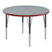A Correll round activity table with a gray top and red T-molded legs.