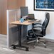 A desk with a laptop and a grey Luxor modular wall divider above it.