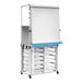 A white Luxor mobile dry erase easel with drawers and wheels.