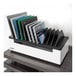 A rectangular white box with several tablet computers in it.