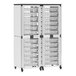 A white double side-by-side stacked modular storage cabinet with whiteboards and plastic bins.