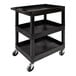 A black three shelf plastic utility cart with wheels.