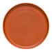 A close-up of a Libbey Driftstone Clay Satin Matte Porcelain Flat Coupe Plate with a brown rim.