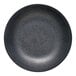 A close-up of a black Reserve by Libbey Ignea porcelain deep coupe plate.