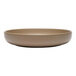 A close up of a Libbey Driftstone sand satin matte porcelain low bowl.