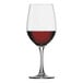 A Spiegelau Bordeaux wine glass filled with red wine.