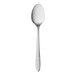 A stainless steel dessert spoon with a white handle.