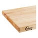 A close up of a Choice wood cutting board with rounded edges.