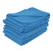 A stack of blue Vestil quilted moving blankets.