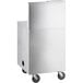 A white rectangular object with wheels and a stainless steel sink bowl inside.