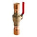 A brass Sioux Chief ball valve with a red handle.