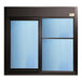 A black rectangular Ready Access drive-thru window with blue Solarban 70XL tempered glass.