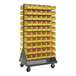 A Quantum gray steel mobile double-sided louvered rack with yellow bins on wheels.