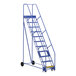 A blue Vestil steel rolling warehouse ladder with wheels.