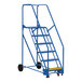 A blue metal Vestil rolling warehouse ladder with black wheels.