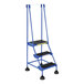 A blue Vestil commercial rolling step ladder with black serrated rubber steps.