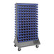 A large gray steel Quantum double-sided louvered rack with blue bins.