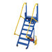 A blue and yellow Vestil steel electric ladder with wheels.