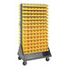 A Quantum gray steel mobile rack with yellow bins on each side.