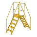 A yellow metal Vestil Crossover ladder with 5 metal steps and handrails.