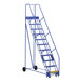 A blue Vestil steel warehouse ladder with wheels.