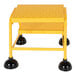 A yellow Vestil commercial rolling step ladder with black rubber feet.