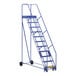 A blue Vestil steel rolling warehouse ladder with grip strut steps and wheels.