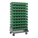 A gray Quantum double-sided louvered rack with green bins on wheels.