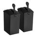 A pair of black plastic ServSense condiment pouch dispensers with a handle.