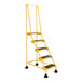 A yellow Vestil commercial rolling step ladder with black serrated steps.