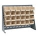 A Quantum steel bench rack with many ivory bins on it.