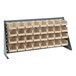 A Quantum gray steel bench rack with 32 ivory bins on it.