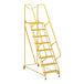 A yellow steel maintenance ladder with perforated steps and metal bars.