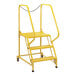 A yellow metal ladder with perforated steps and three steps.