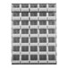 A Quantum gray louvered panel with clear bins hanging on a wall.
