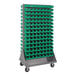 A gray steel Quantum double-sided mobile rack with green bins on one side.