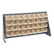 A Quantum gray steel bench rack with many ivory bins on it.