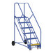 A blue steel Vestil rolling warehouse ladder with black wheels.