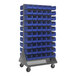 A Quantum gray steel mobile double-sided louvered rack with blue bins on it.