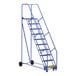 A blue Vestil steel rolling warehouse ladder with wheels.
