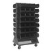 A gray Quantum steel mobile double-sided louvered rack with black bins on it.