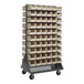 A Quantum gray steel mobile rack with many ivory bins on it.