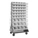 A Quantum gray steel mobile rack with clear plastic bins attached to it.