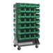 A gray Quantum double-sided louvered rack with green bins on it.