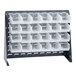 A gray steel Quantum rack with clear plastic bins on it.