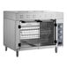 A Cooking Performance Group electric countertop rotisserie oven with a door and baskets inside.