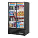 A True Refrigerated Glass Door Merchandiser full of drinks with LED lighting.