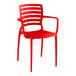 A red plastic Lancaster Table & Seating Sol Buoy arm chair.